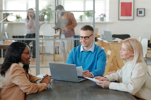HR team reviewing employee data on a laptop for GDPR compliance